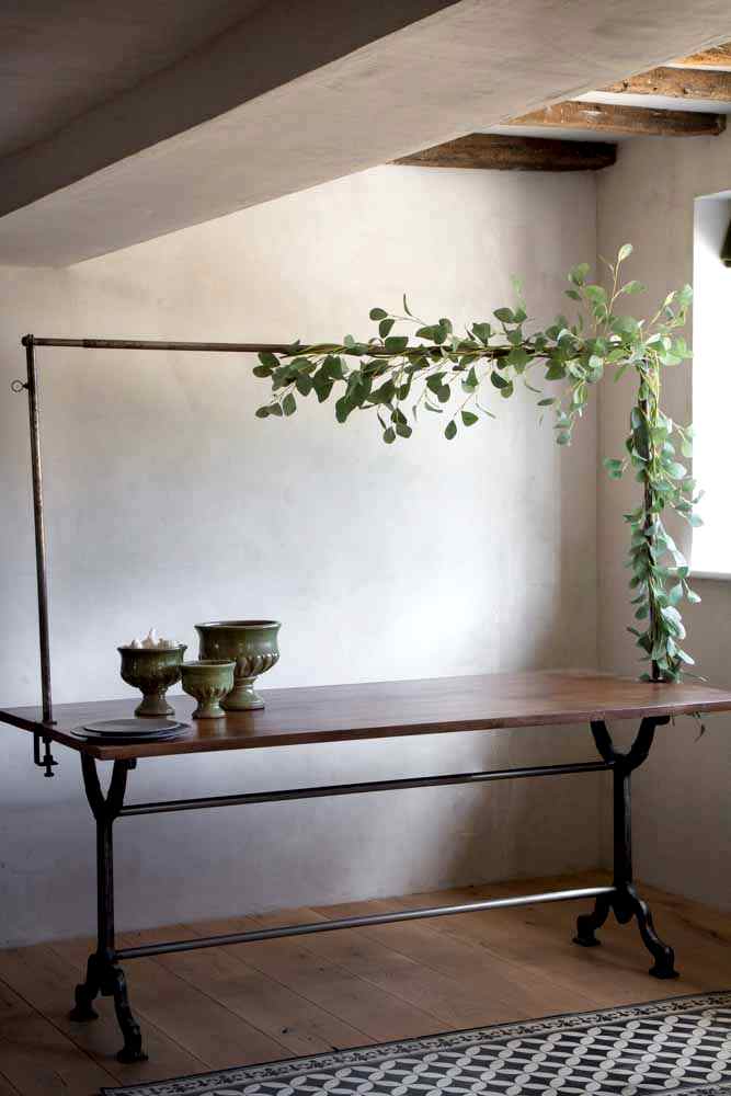 Lifestyle image of the Clamp-On Table Stand For Hanging Decorations Over Your Table