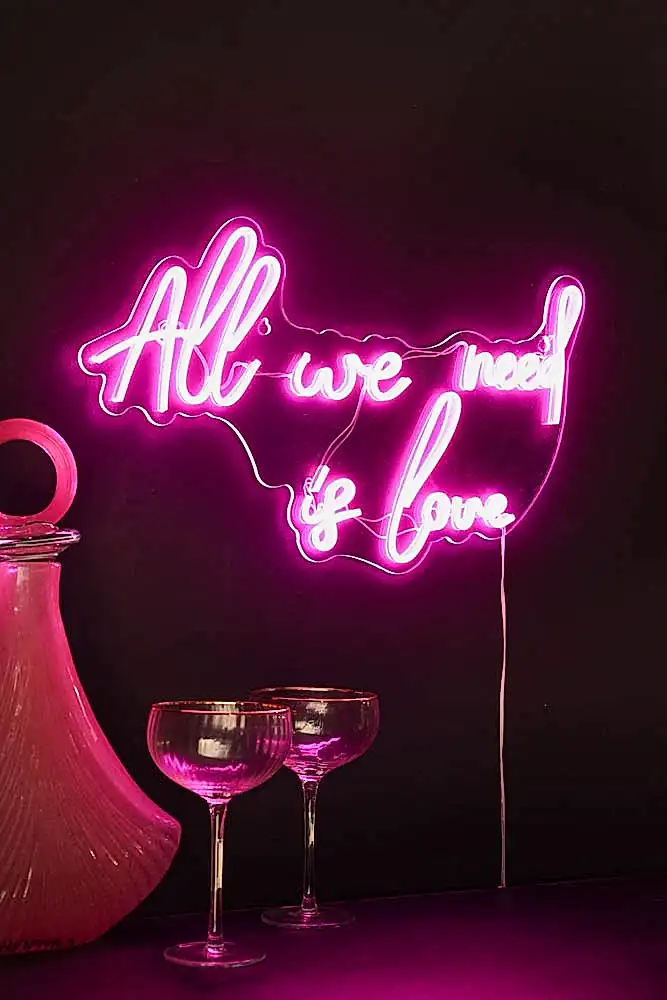 Lifestyle image of the All We Need Is Love LED Acrylic Neon Light