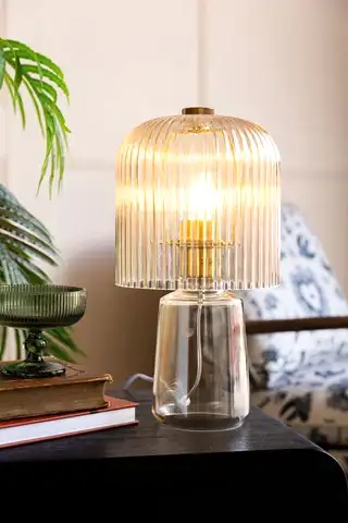 A champagne-coloured  ribbed glass table lamp 