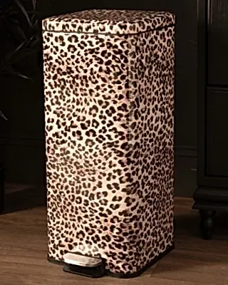 A tall rectangular pedal pin with a leopard print pattern in beige, brown, and black, featuring a silver and black foot pedal on a wooden floor.