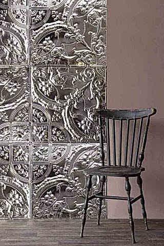 A lifestyle image of a room set featuring Rockett St George tin tiles with a metal traditional chair.
