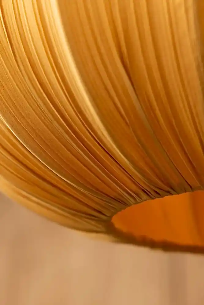 Close-up of the base of the Ochre Pleated Fabric Ceiling Light.