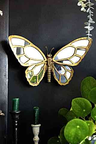 Lifestyle image of the Gold Butterfly Decorative Wall Mirror