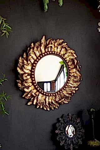 Lifestyle image of the Golden Feather Round Mirror