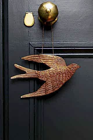 Lifestyle image of the Gold Swallow Hanging Ornament