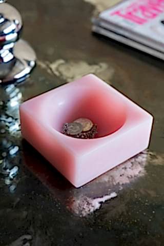 The HKLIVING Pink Modernist Cube Ornament shown on a foxed glass coffee table with jewellery and coins inside.