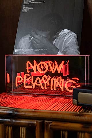 Lifestyle image of the Now Playing Neon Light Box