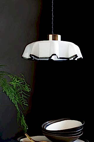 Image of the Monochrome Pleated Glass Easyfit Ceiling Light Shade shown in a kitchen against black walls with bowls in the shot. 