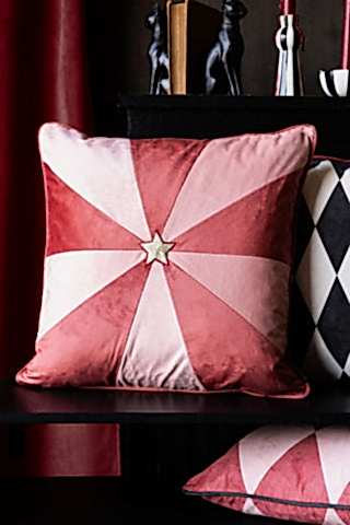 Lifestyle image of the Pink & Red Embroidered Star Cushion