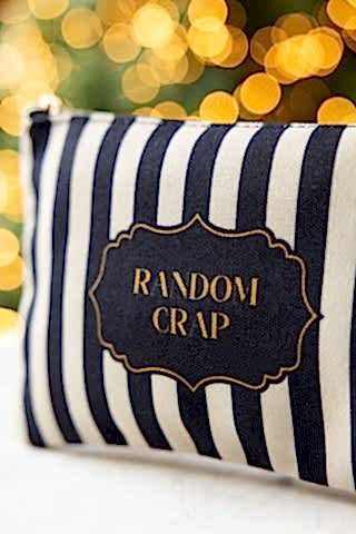 Close up detail of the Random Crap Striped Canvas Pouch. 