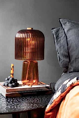 Lifestyle image of the Amber Seventies Glass Table Lamp