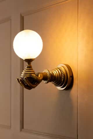 Lifestyle image of the Vintage-Style Hand Wall Light