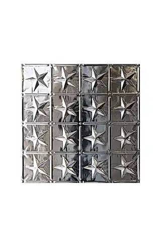Image of a decorative tin tile with grid and star shapes on a plain white background.