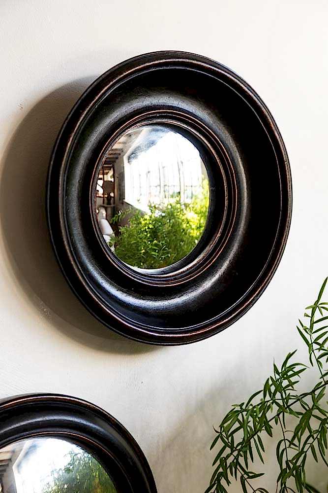 Lifestyle image of the Antique Black Deep Framed Small Convex wall Mirror